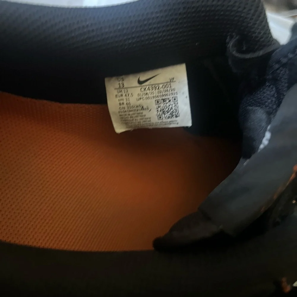 Nike Black Sneakers with Orange Detail